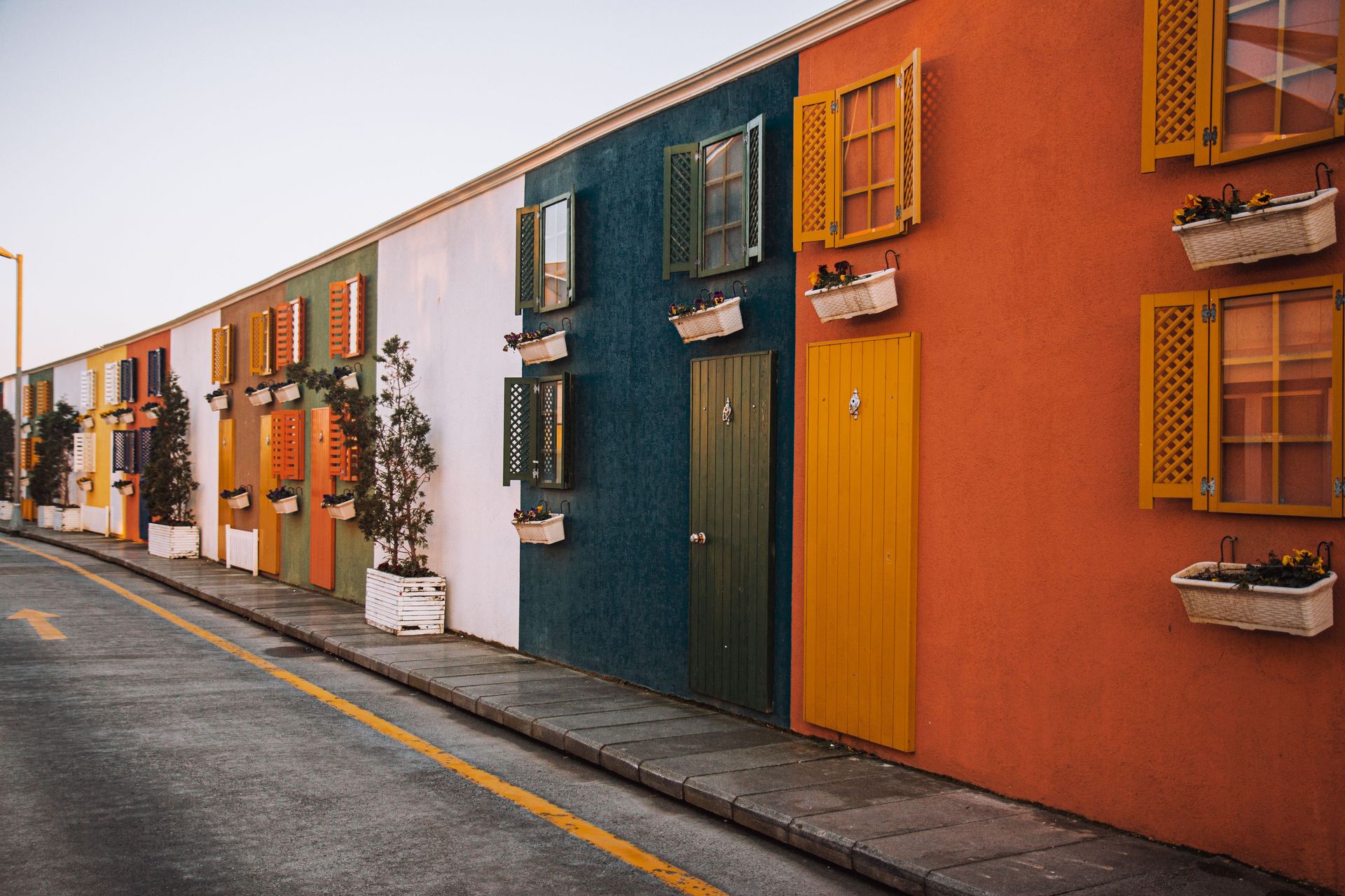 Vibrant multi-colored facades with window shutters in a street in İstanbul.